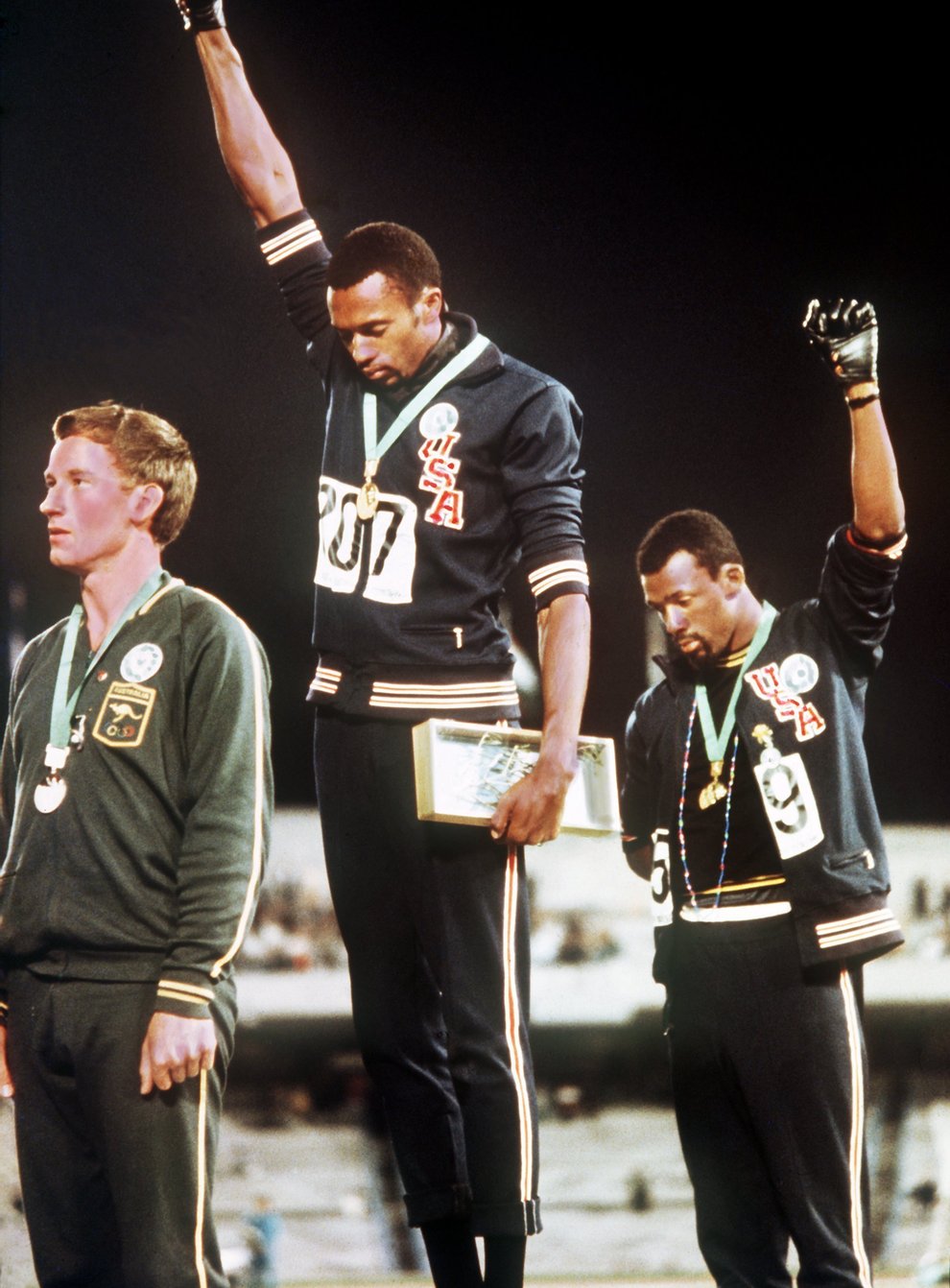 Tommie Smith and John Carlos bowed their heads and raised black-gloved fists in protest at the 1968 Mexico Olympics