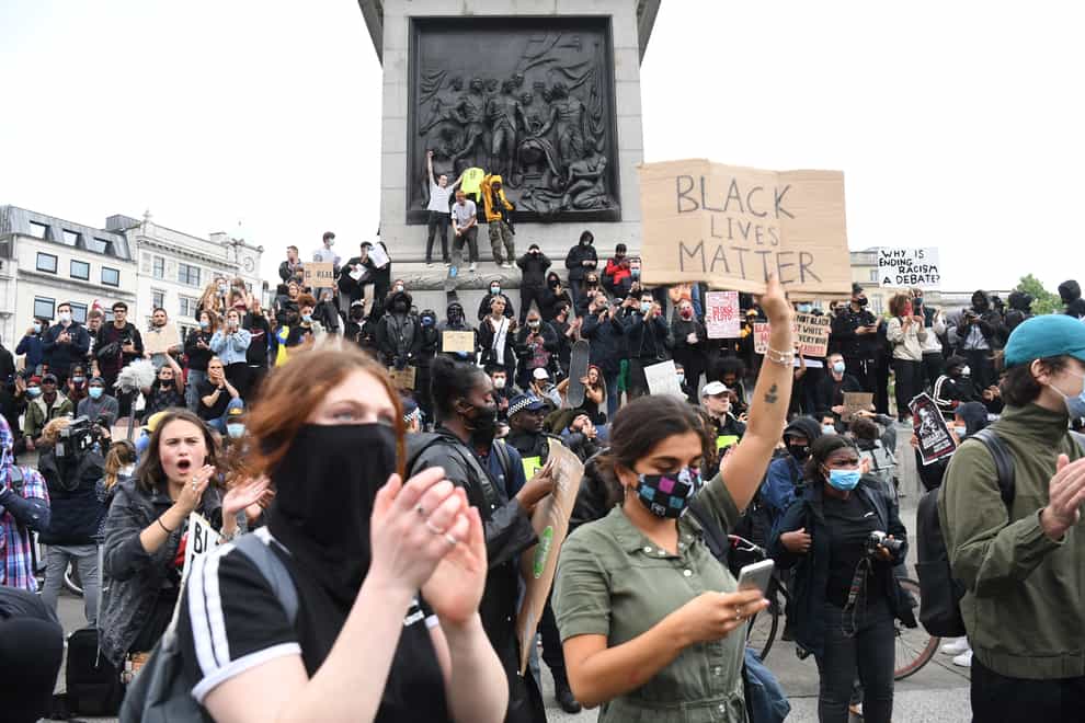 People participate in a Black Lives Matter protest rally in Trafalgar Square