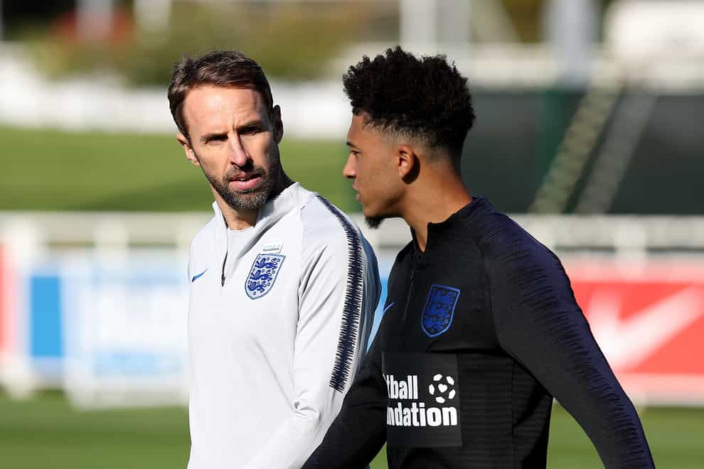 England manager Gareth Southgate (left) believes Jadon Sancho just needs to play football