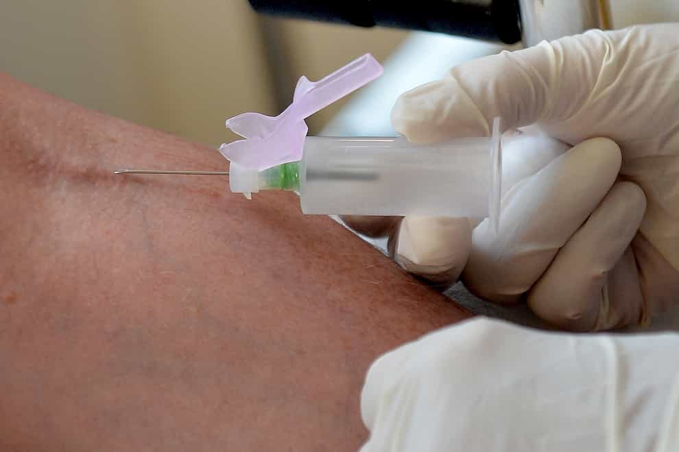 A nurse taking blood