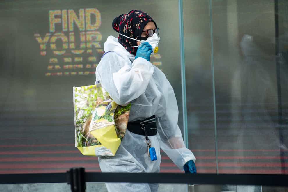 One shopper wore full PPE as she headed to Birmingham's Primark store on Monday (Jacob King/PA)