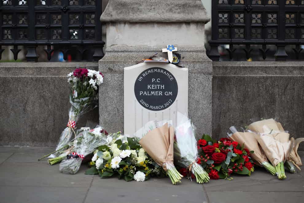 Flowers placed around the memorial to honour Pc Keith Palmer