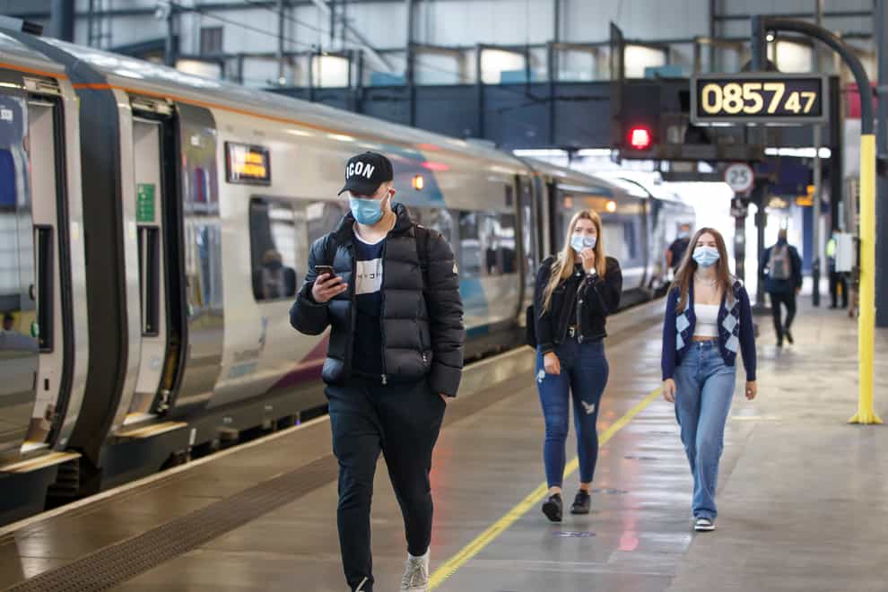 Passengers wearing face masks at Leeds railway station