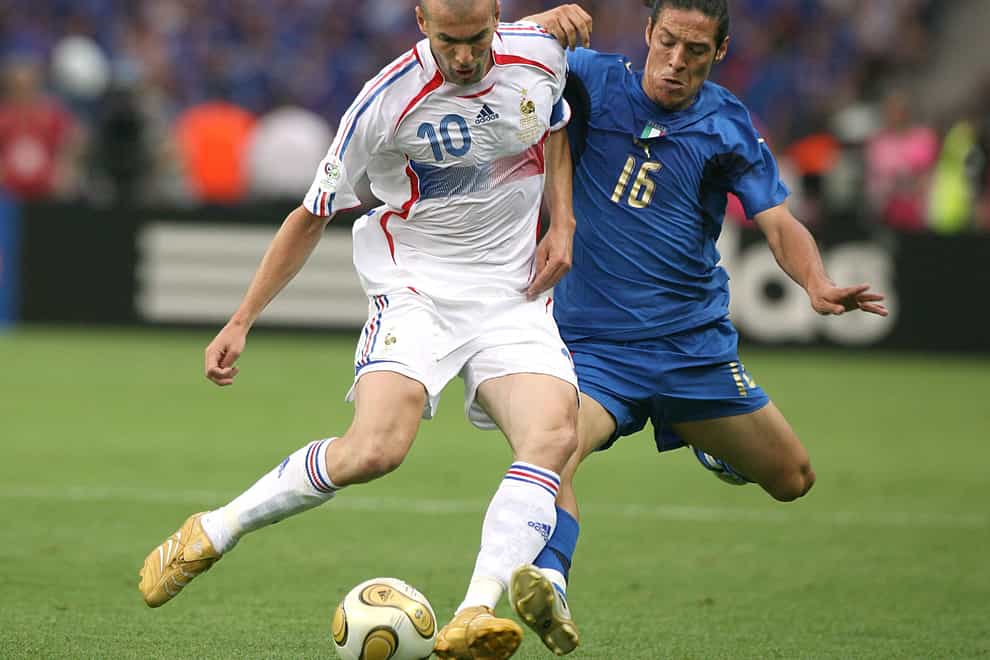 Mauro Camoranesi, right, challenges Zinedine Zidane for the ball in the 2006 World Cup final