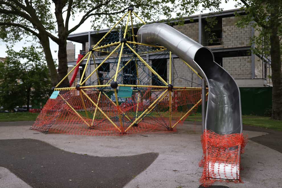 Activity equipment in the children’s playground area of a park in London is closed off (Yui Mok/PA)