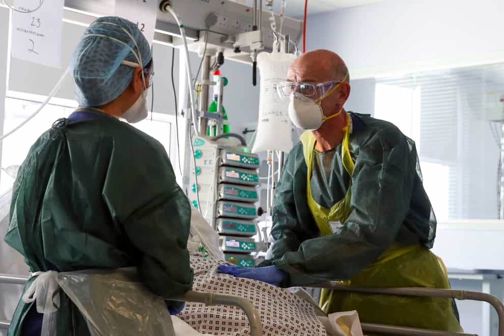 Doctors treat a coronavirus patient