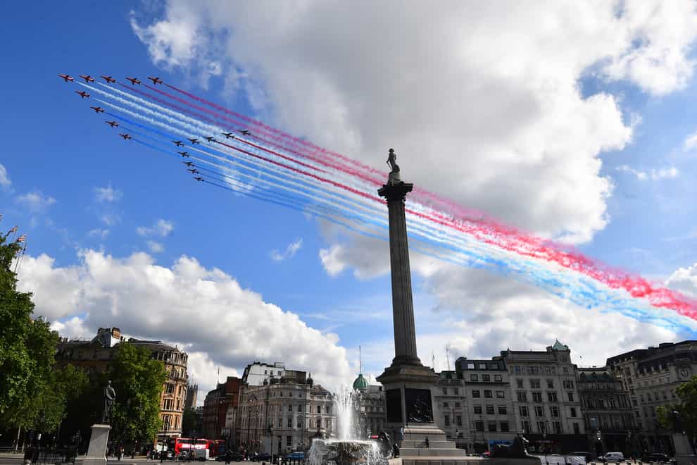 The Red Arrows and their French equivalent, La Patrouille de France, fly over the statue of Admiral Nelson in Trafalgar Square