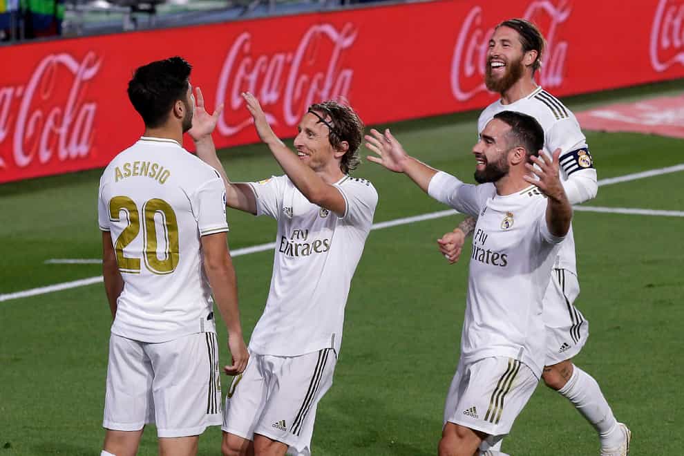 Real Madrid’s Marco Asensio celebrates with his teammates