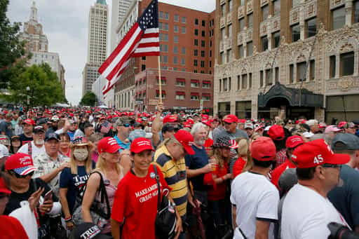 President Donald Trump supporters line up to enter a security gate before a rally at the BOK Center in Tulsa