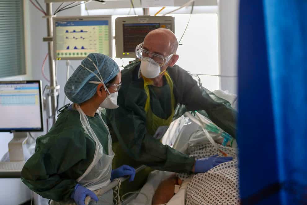 Doctors treat a patient suffering from coronavirus