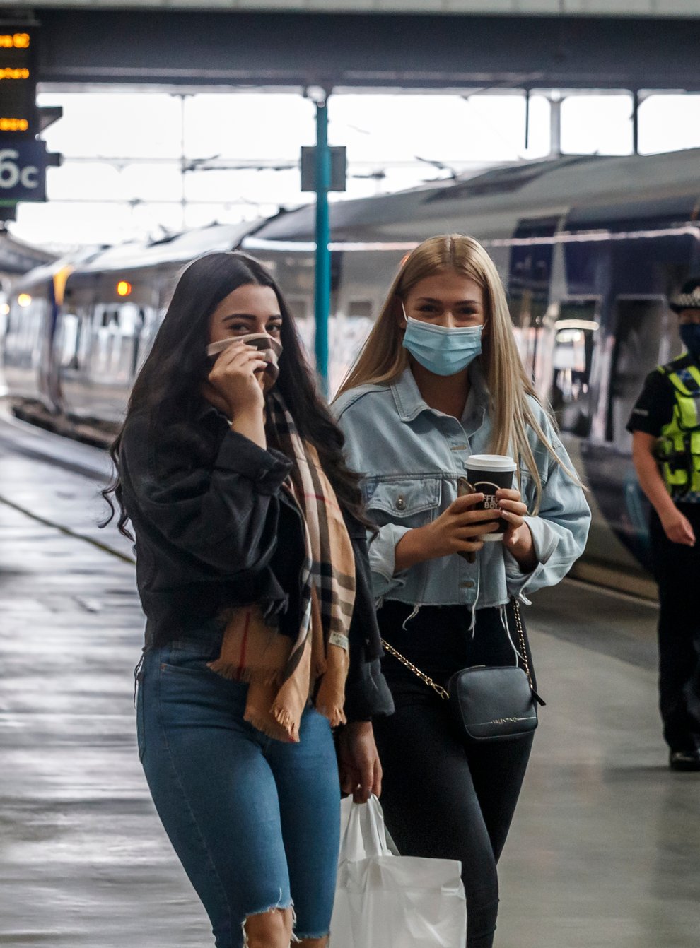 Passengers wearing face masks at Leeds railway station