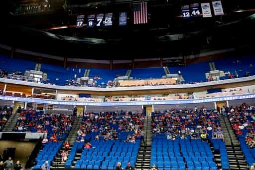 Empty seats are seen as people listen to President Donald Trump speak during a rally at the BOK Center in Tulsa