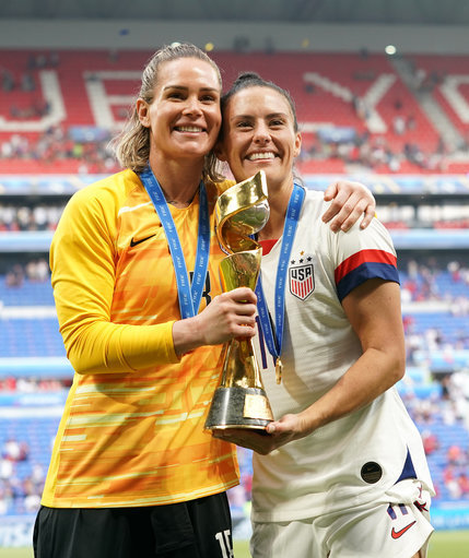 Orlando's Ashlyn Harris and Ali Krieger celebrate with the FIFA Women's World Cup Trophy, but will miss out on the Challenge Cup
