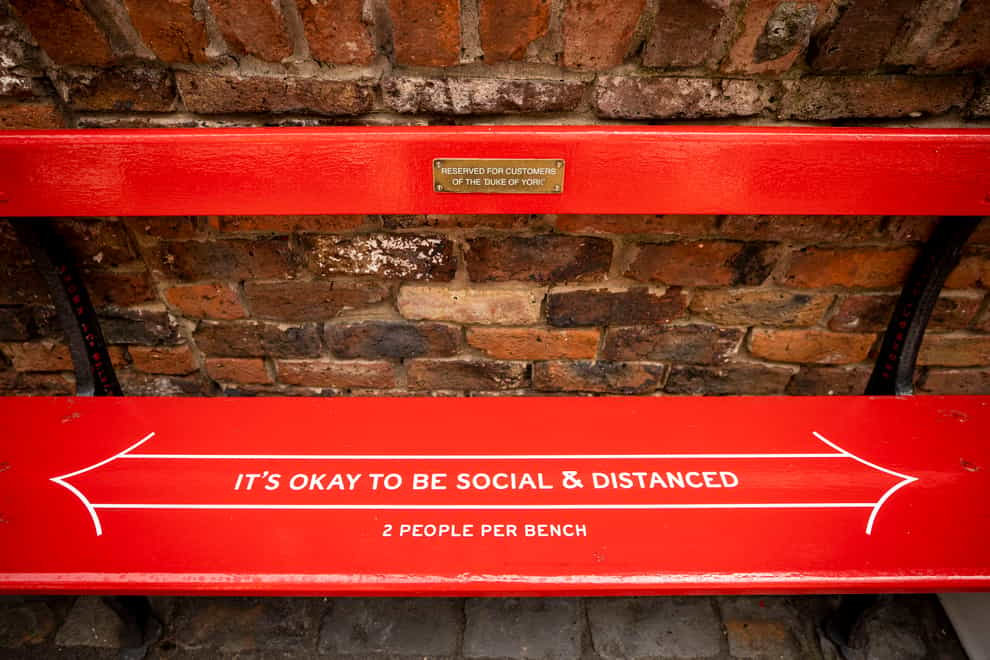 The Duke of York Bar in Belfast where the bar owner has put quirky social distancing messages on benches outside