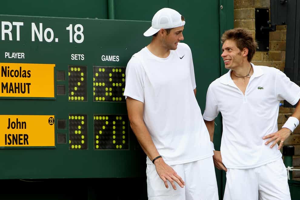 Isner and Mahut, right, re-wrote the record books at Wimbledon on this day in 2010