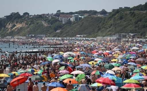 Thousands of sunseekers have descended on Bournemouth's beaches as temperatures soar