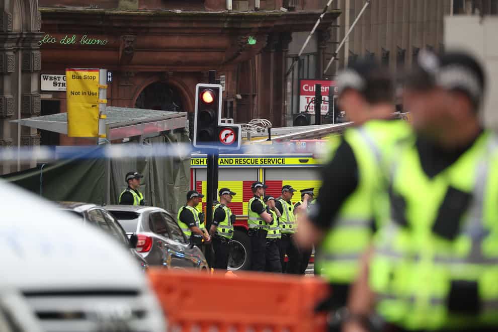 Police officers at the scene of the atttacks in Glasgow's  West George Street