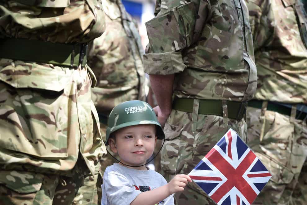 A child waves a union flag on a previous Armed Force Day in Edinburgh