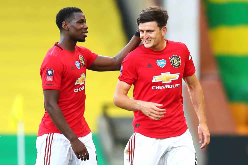 Manchester United are looking forward to the FA Cup semi-finals after Harry Maguire, right, scored a late winner against Norwich