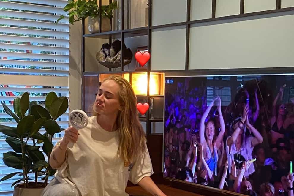 Adele posted pictures watching her headline Glastonbury set from home