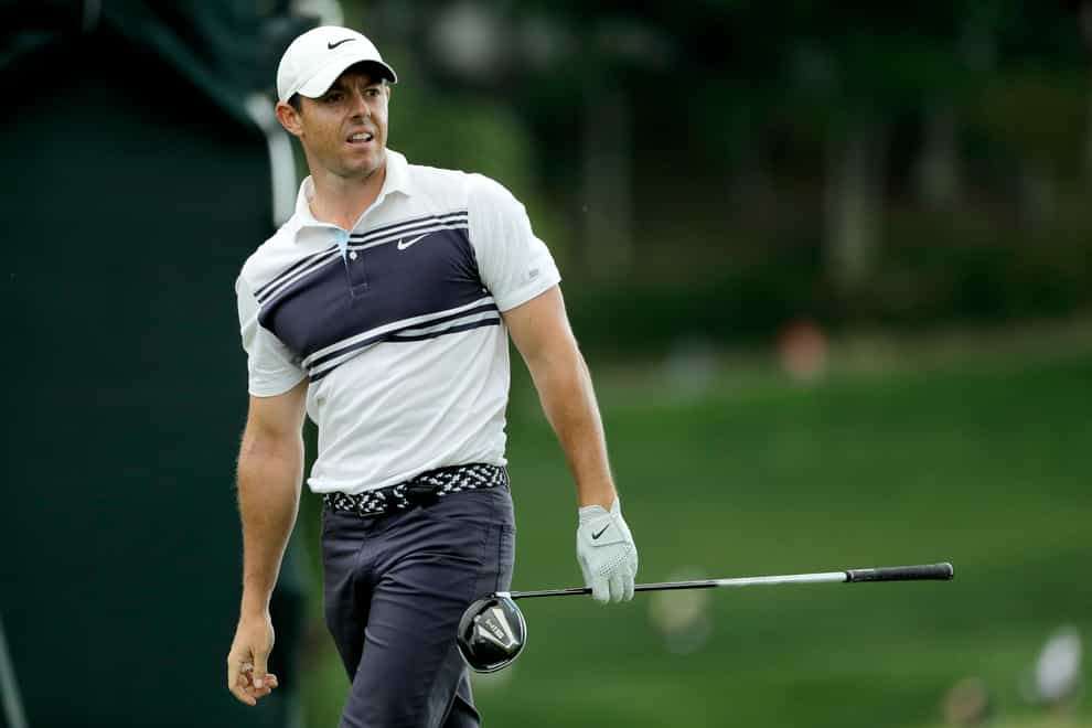 Rory McIlroy watches his tee shot on the 18th hole during the second round of the Travelers Championship