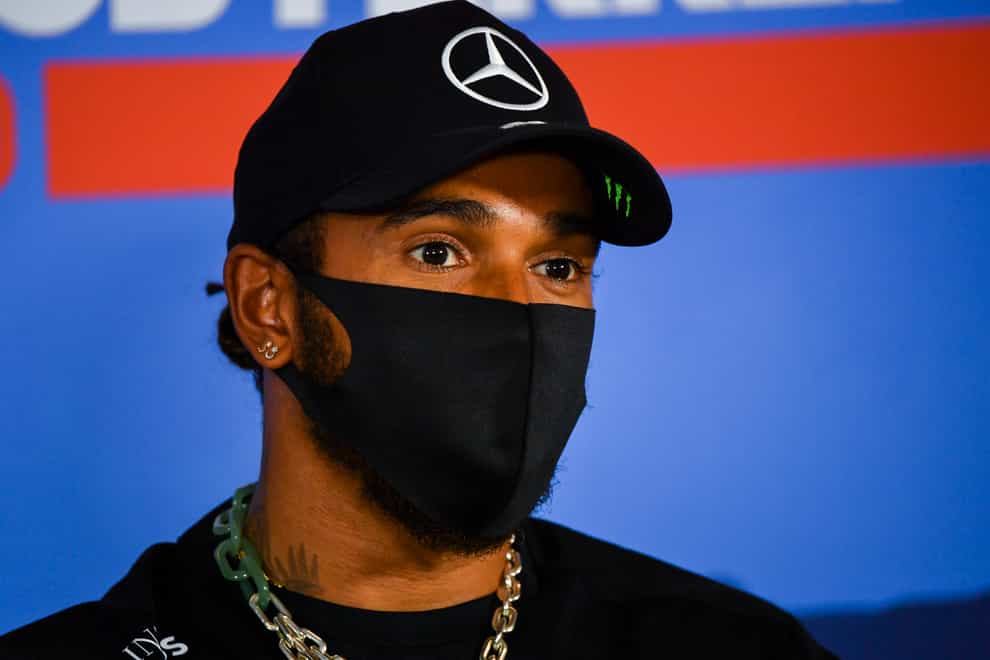 Lewis Hamilton sported a mask as he faced the media