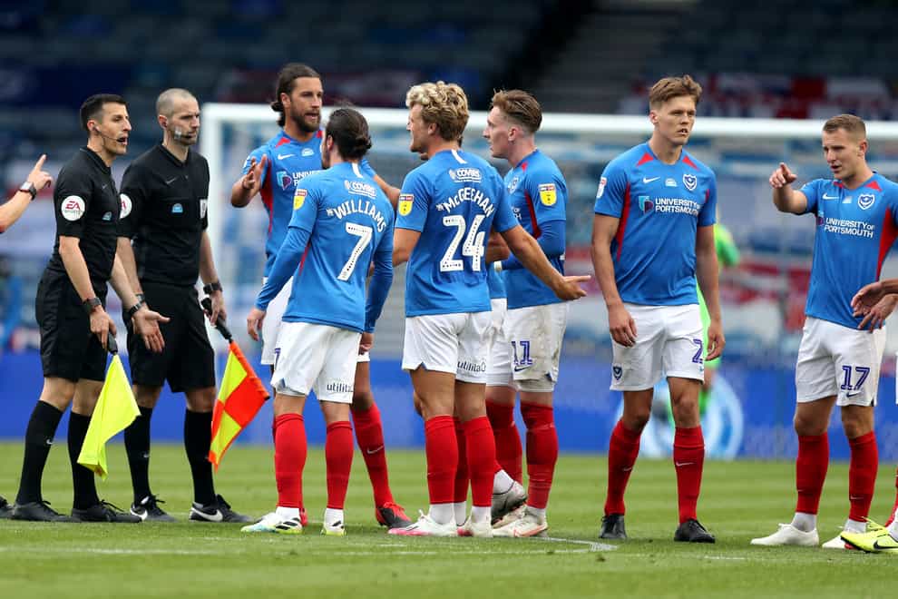 Portsmouth players speak to the match officials after the game