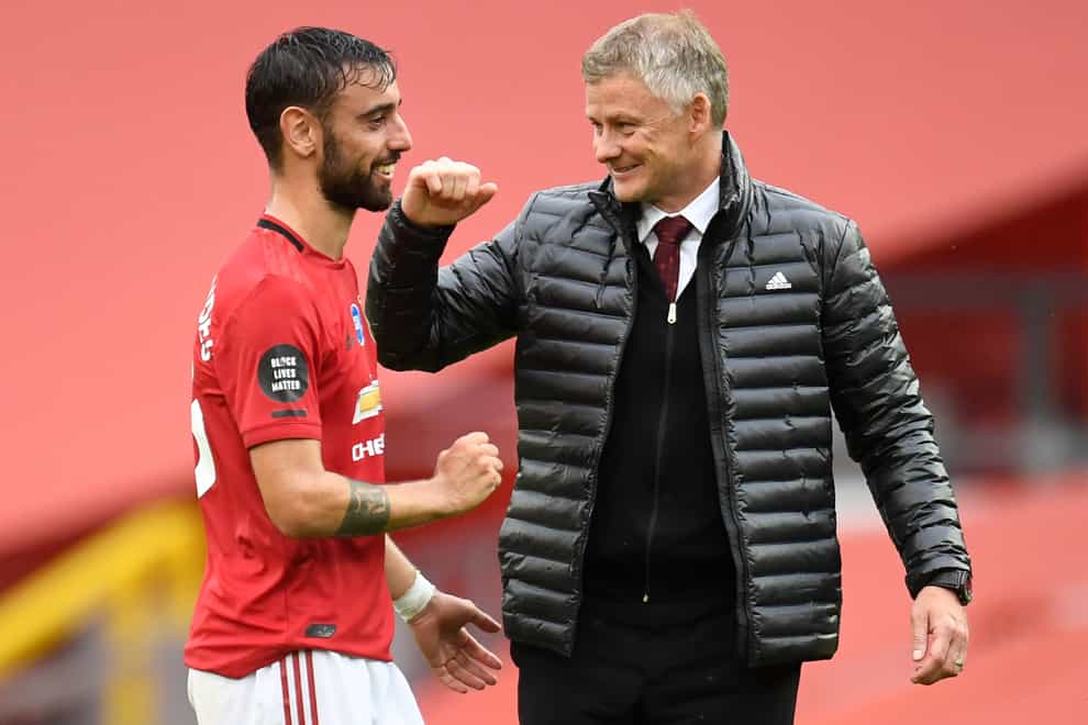 Ole Gunnar Solskjaer, right, and Bruno Fernandes celebrate United's victory at Bournemouth