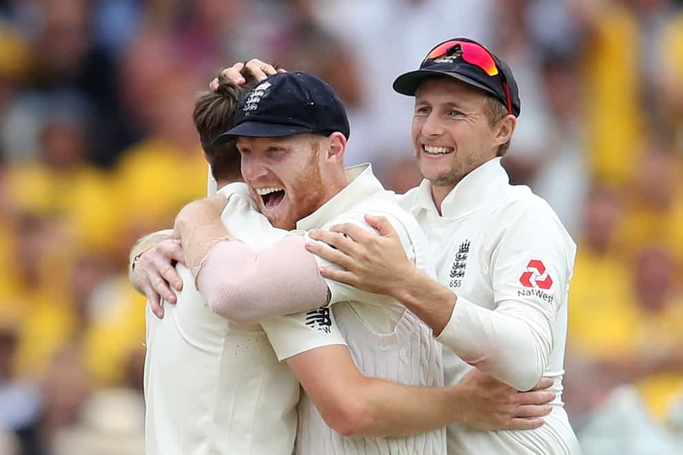 Ben Stokes, centre, will captain England in the absence of Joe Root, right (Tim Goode/PA)