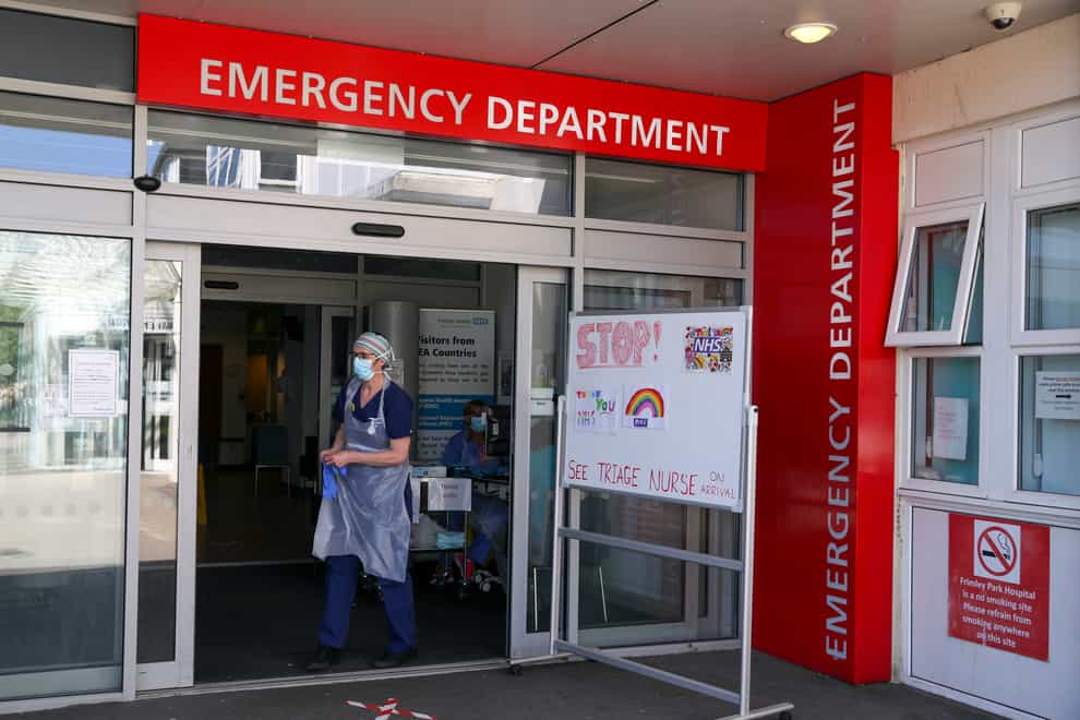 A triage nurse waits for patients