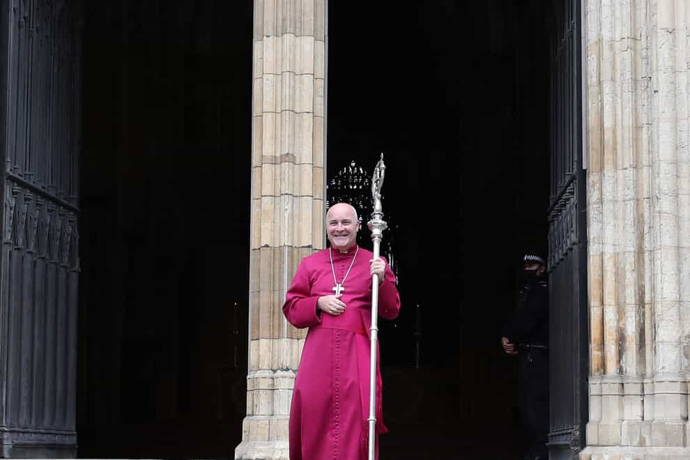 The 98th Archbishop of York, Bishop Stephen Geoffrey Cottrell, takes up the historic Braganza crozier at York Minster (Peter Byrne/PA)