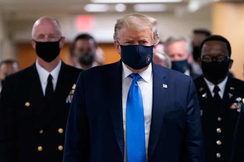Donald Trump is pictured wearing a facemask for the first time 