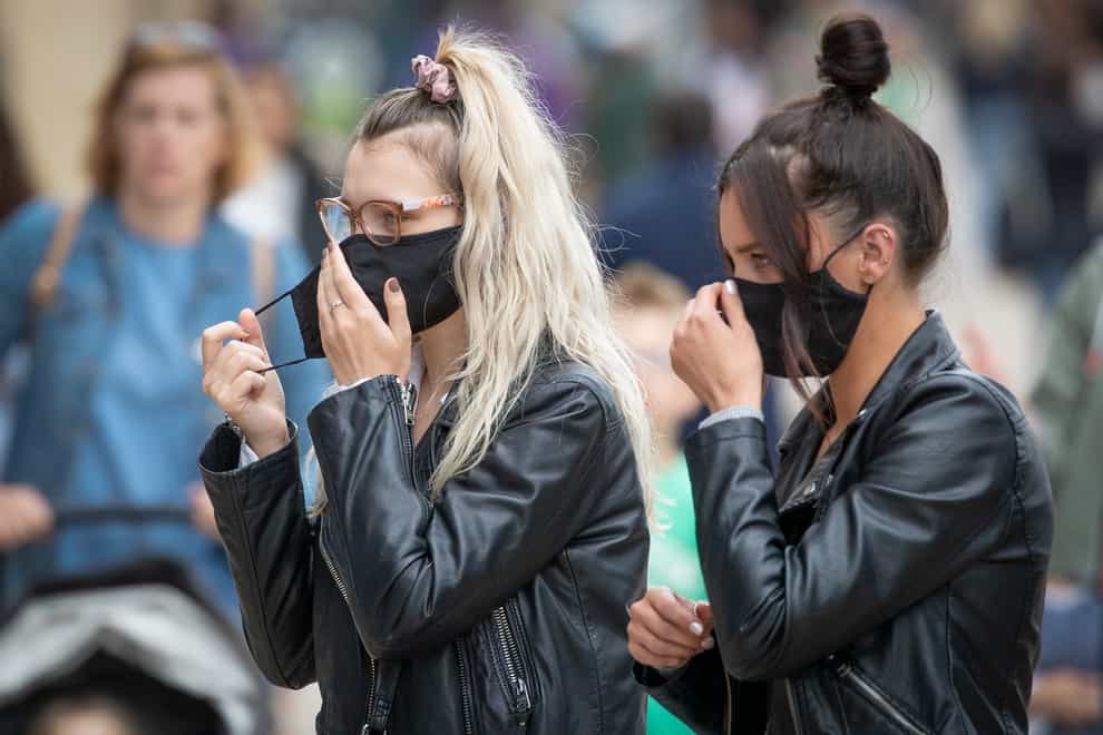 Shoppers wear protective face masks