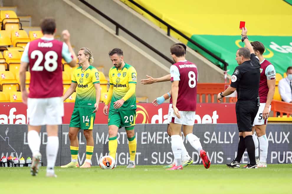 Referee Kevin Friend sent off two Norwich players including Josip Drmic, as the Canaries finished the match with nine men
