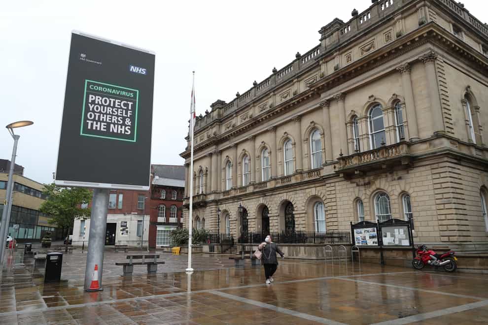 An advisory from the UK Government on a billboard in Blackburn town centre (Peter Byrne/PA)