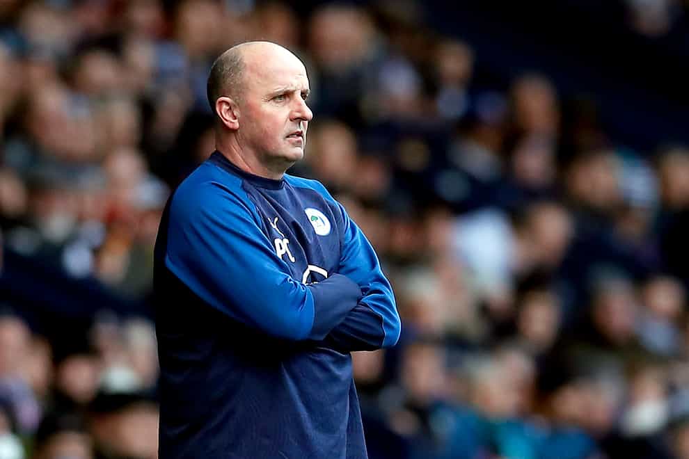 Paul Cook's Wigan are facing a 12-point penalty after going into administration (Martin Rickett/PA)