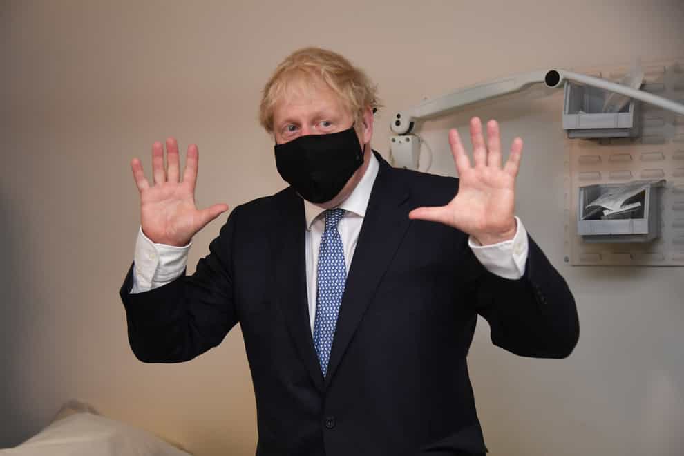 Prime Minister Boris Johnson during a visit to Tollgate Medical Centre in east London