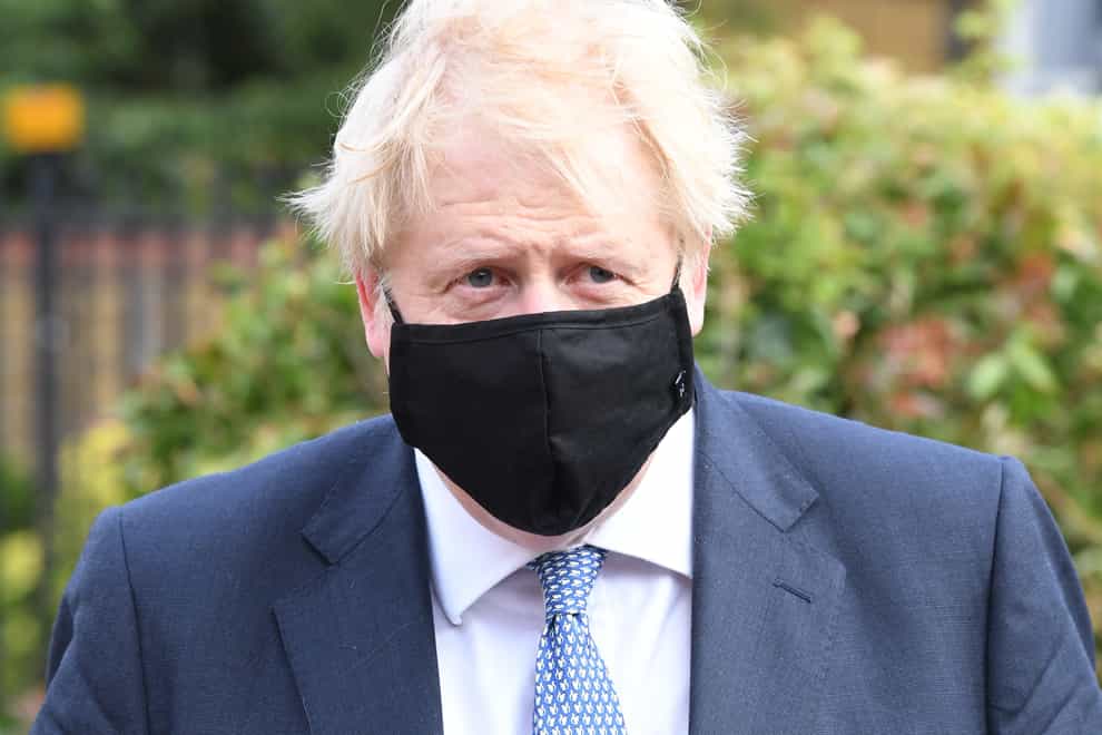 Boris Johnson wearing a face covering