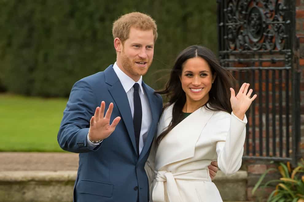 Duke and Duchess of The Queen was ‘hurt’ when the Sussexes launched their own website, a new book claims 