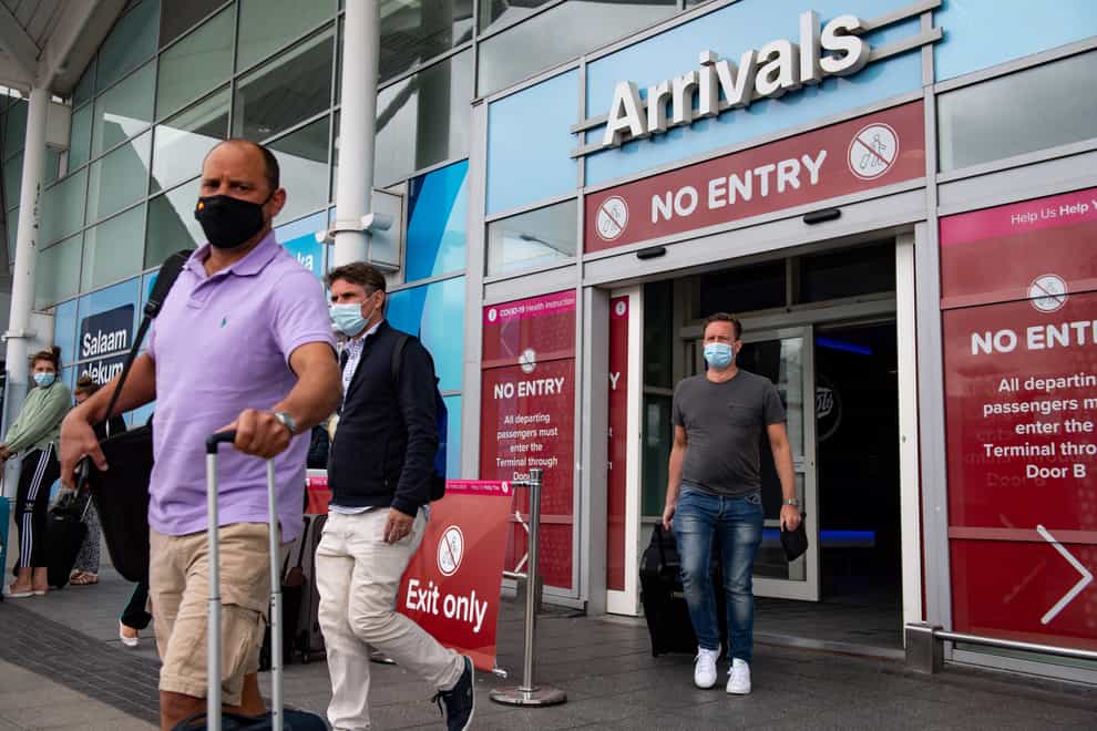 Passengers arrive at Birmingham Airport on a flight from Malaga