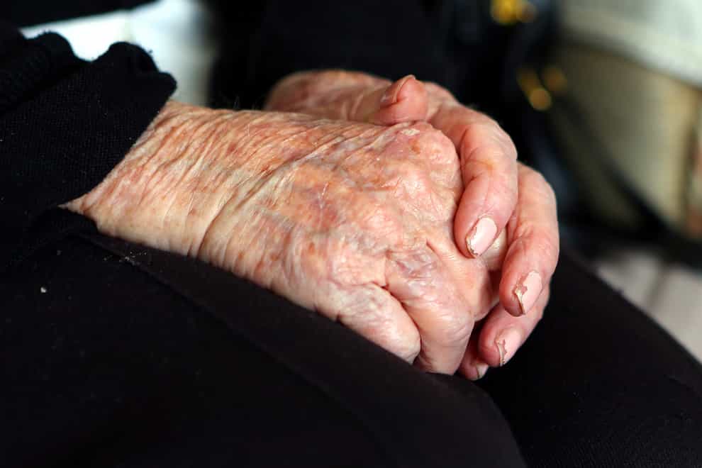 An elderly person's hands