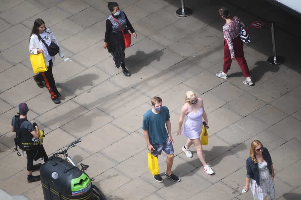 People walk in a public square