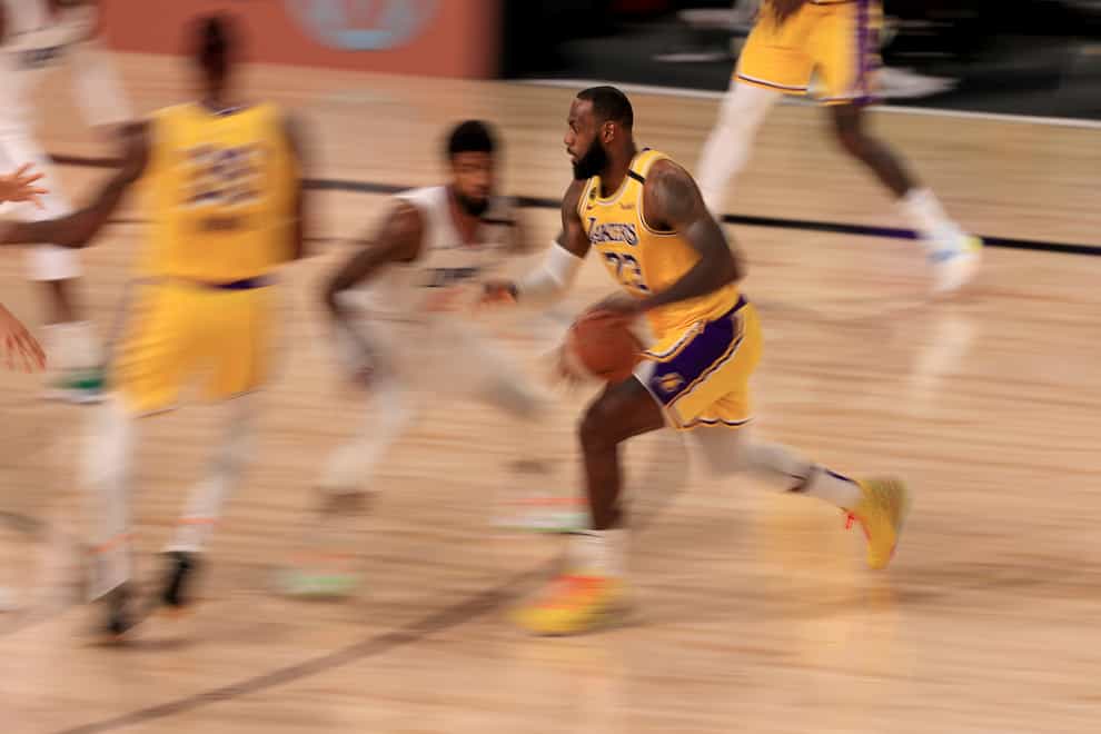 Los Angeles Lakers LeBron James drives towards the basket in his side’s narrow win over the LA Clippers as the NBA resumed on Thursday 