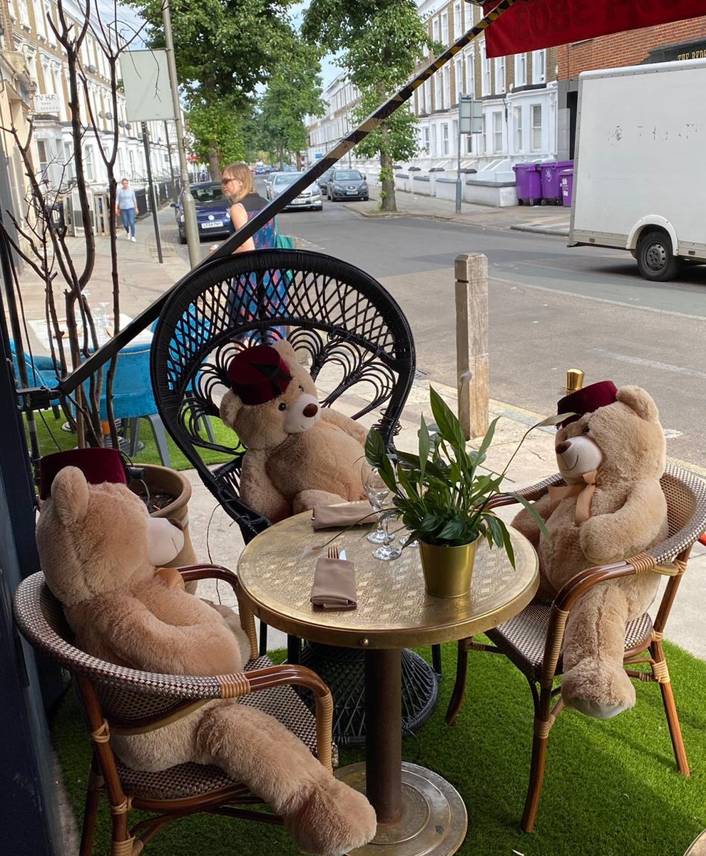 Cuddly toy bears sit in seats at Tagine in Balham to enforce social distancing at the restaurant