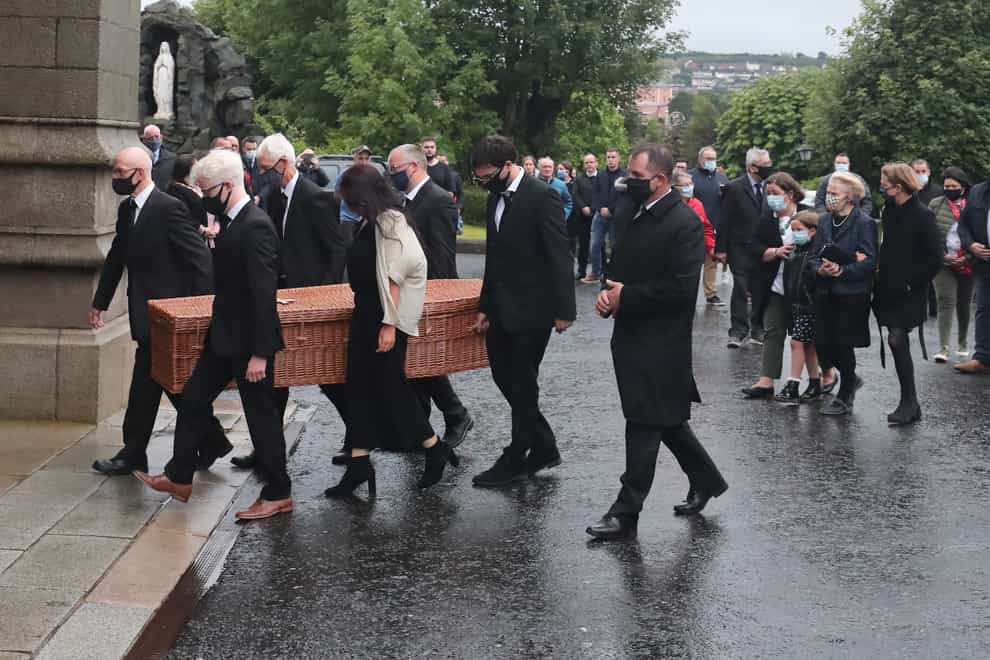 Family members form a guard of honour as the coffin of John Hume is taken into St Eugene’s Cathedral in Londonderry
