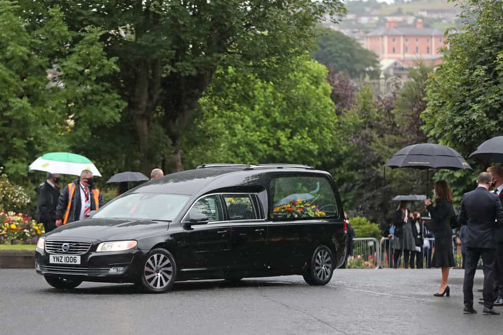 The hearse carrying the body of John Hume arrives at St Eugene’s Cathedral