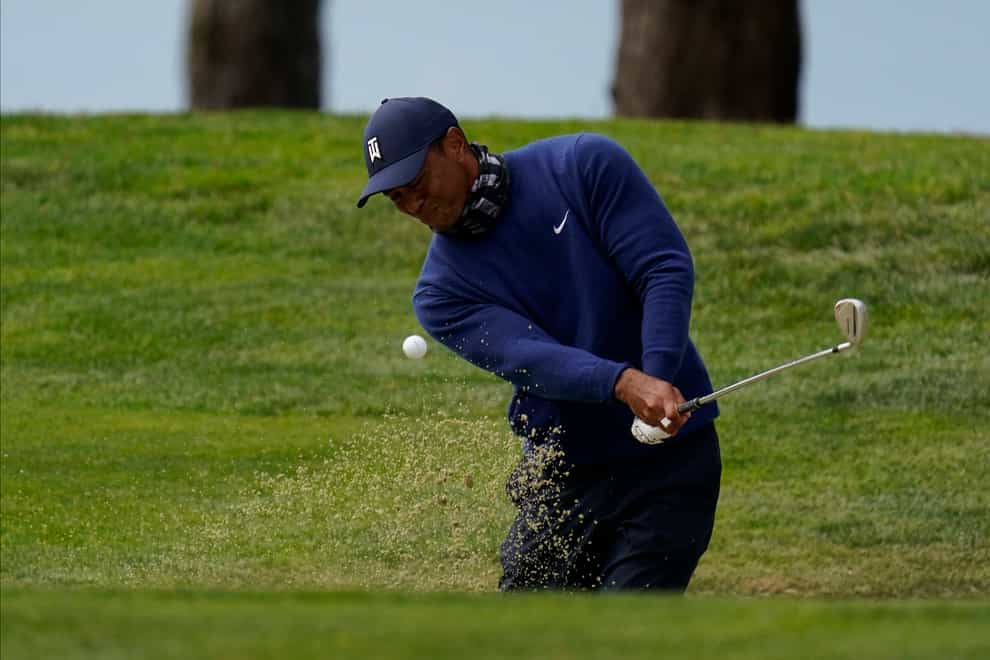 Tiger Woods hits from the bunker on the 14th hole during the first round of the US PGA Championship