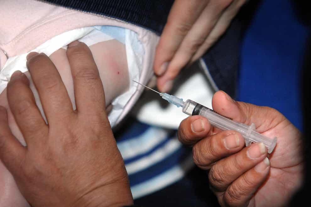 A child is given a vaccination