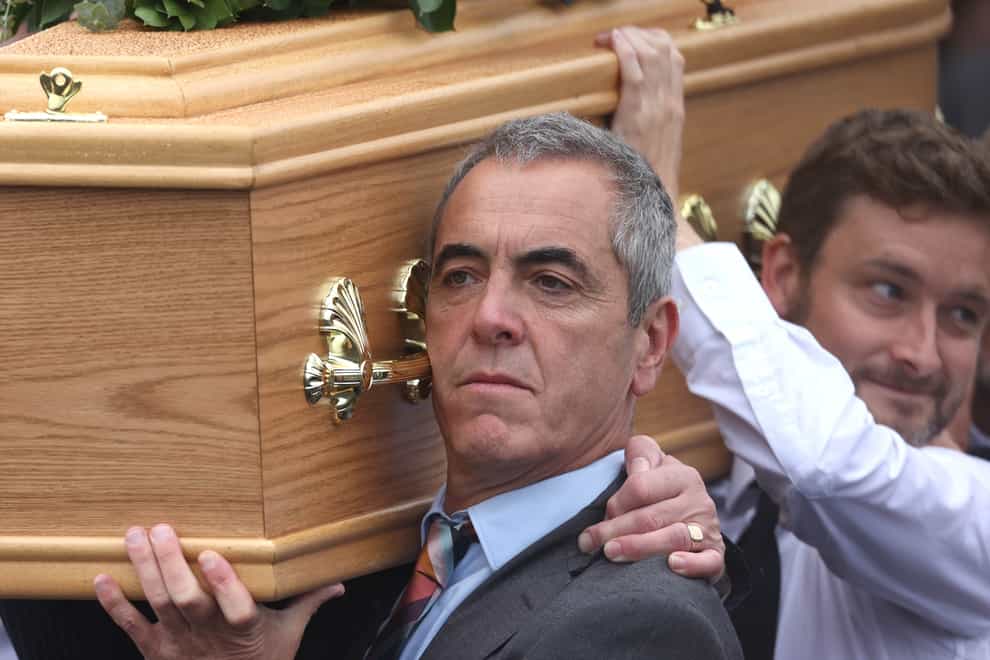 Actor James Nesbitt carries his father's coffin