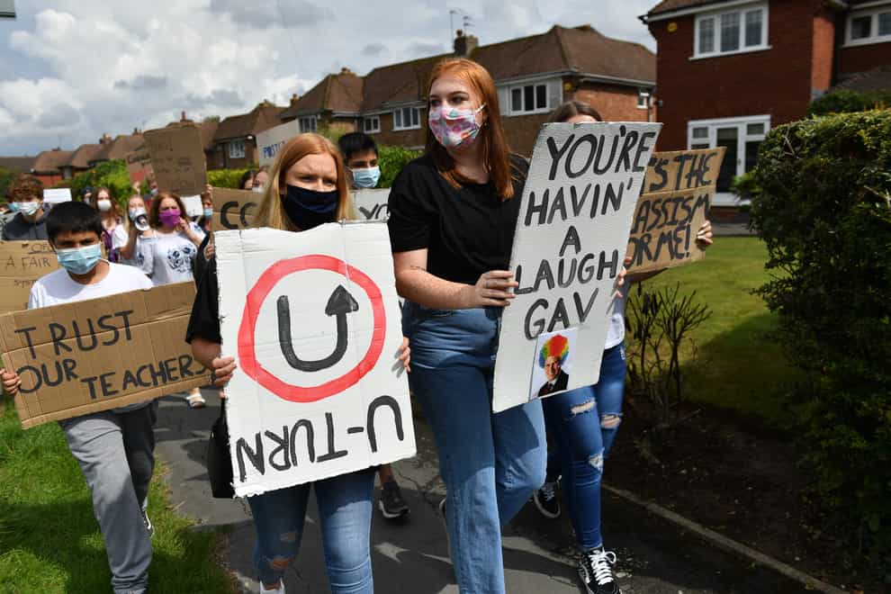 Students from Codsall Community High School march to the constituency office of their local MP Gavin Williamson, who is also the Education Secretary, as a protest over the continuing issues of last week’s A level results